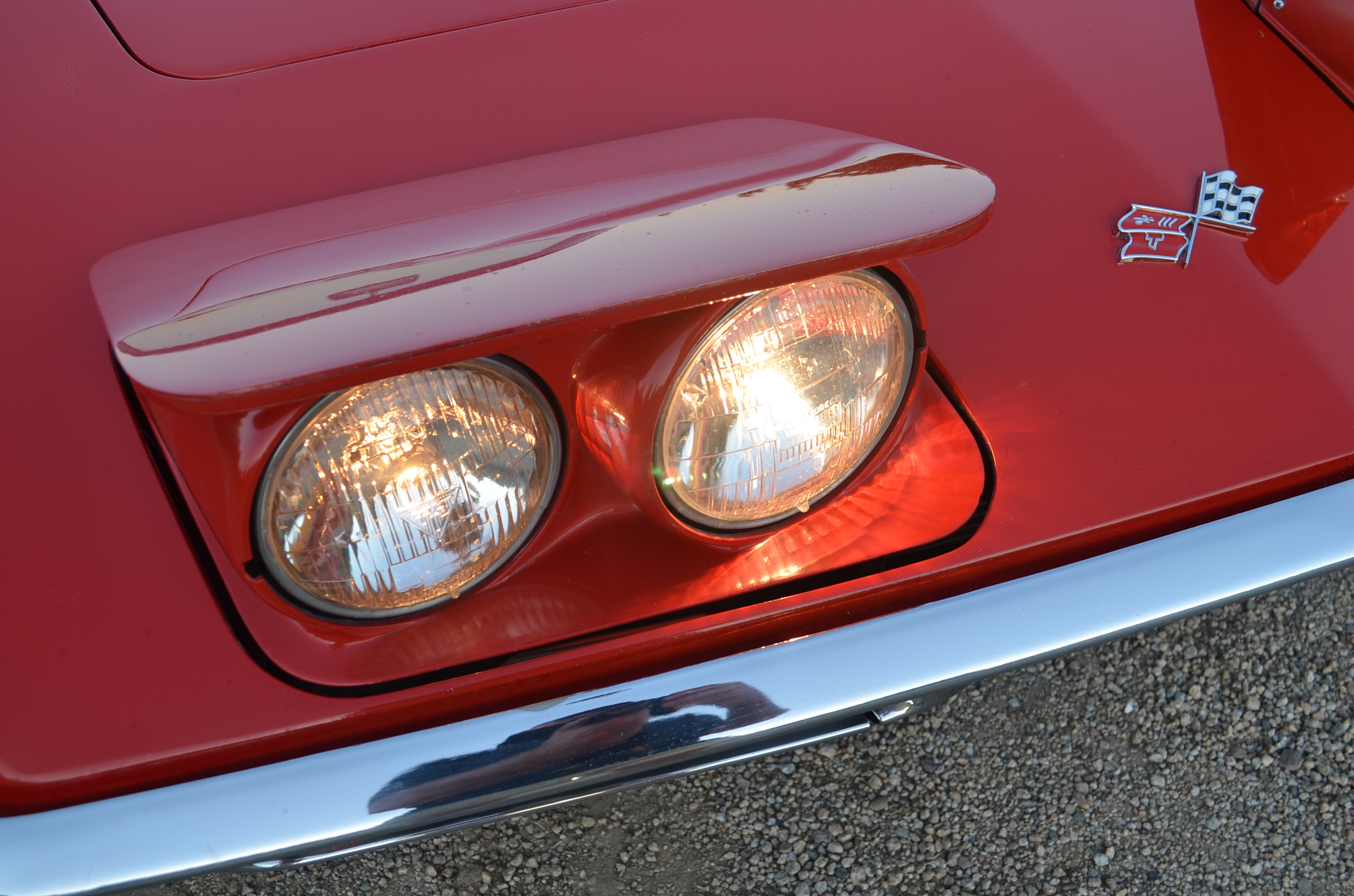 Red Chevrolet Corvette headlight classic car